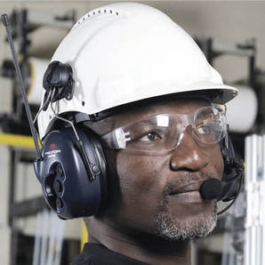 Person wearing peltor 3M litecom basic helmet mount communications with hearing protection